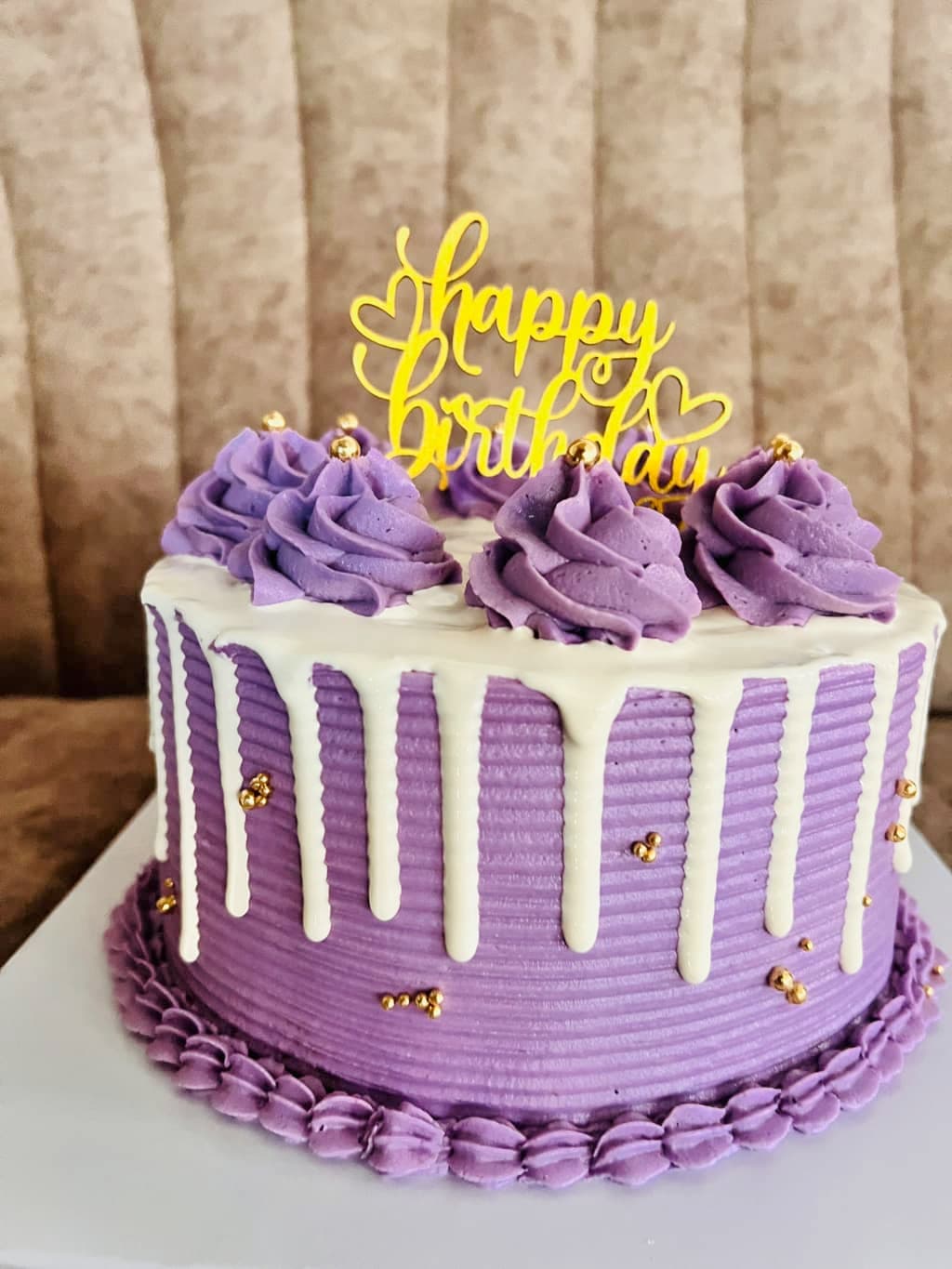Purple drip cake with a custom finish — image 2