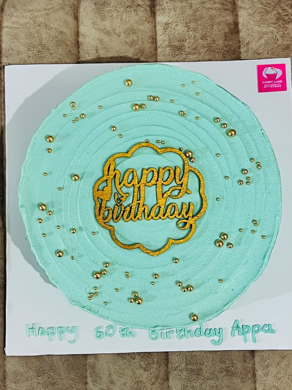 Cream and gold eggless birthday cake — image 2